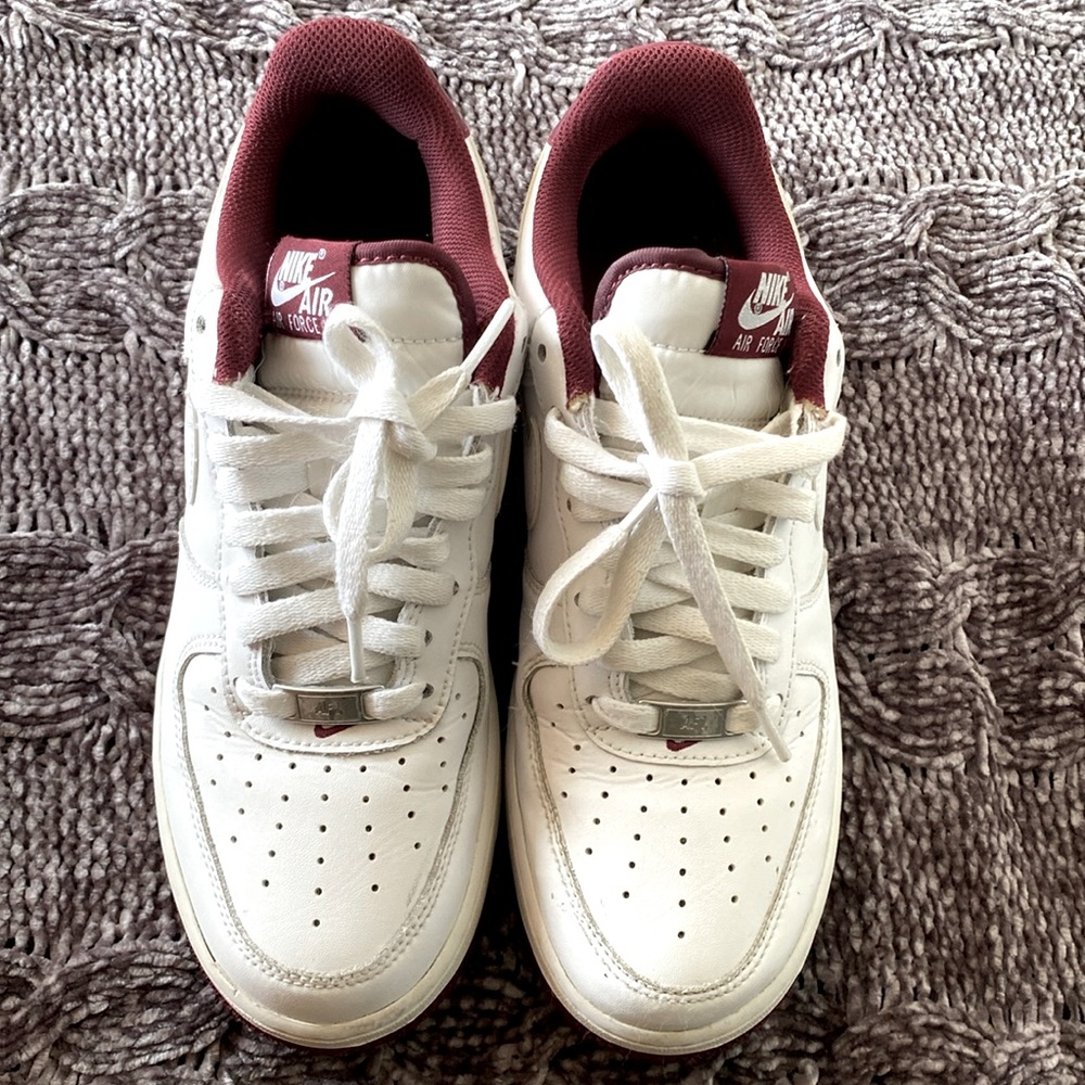 Nike Air Force, white with burgundy bottom, size 7.5 men’s.